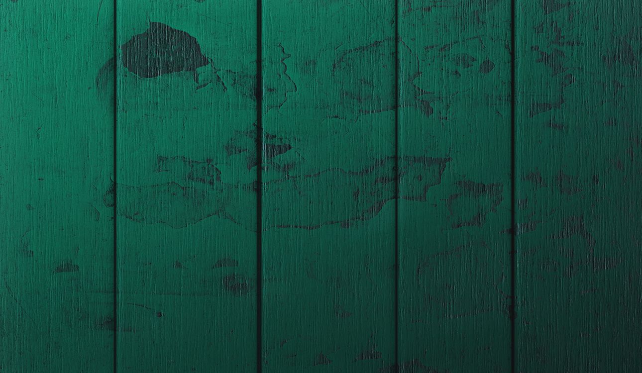 green wooden wall with hole