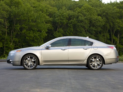 Image silver sedan parked on gray asphalt road