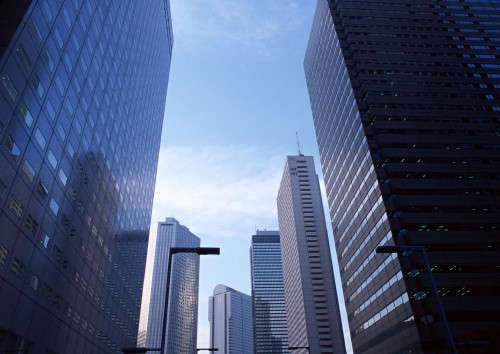 Image white and blue high rise buildings under blue sky during daytime