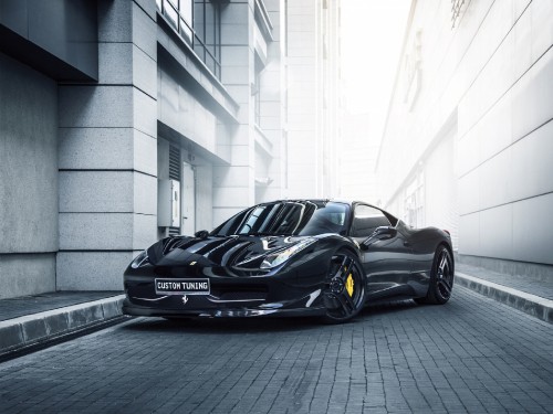 Image black porsche 911 parked beside white concrete building