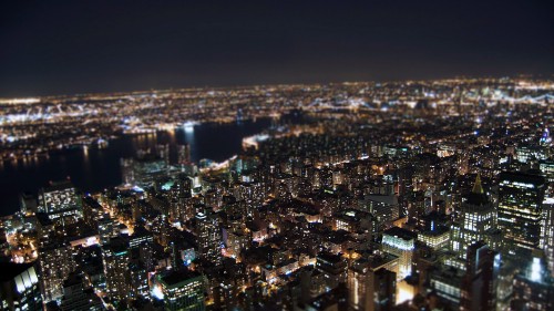 Image aerial view of city buildings during night time