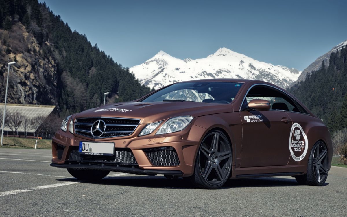 brown audi coupe on road during daytime