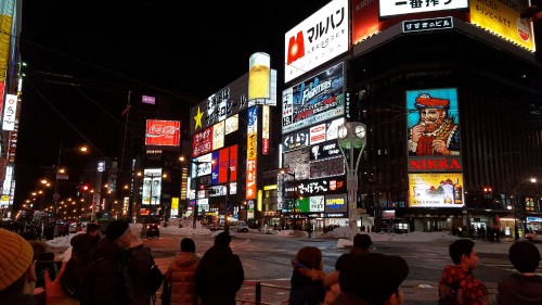 Image people walking on street during night time