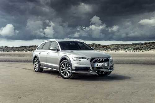 Image silver audi a 4 on brown field under white clouds and blue sky during daytime