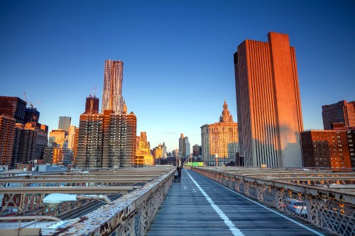 Image people walking on sidewalk near high rise buildings during daytime