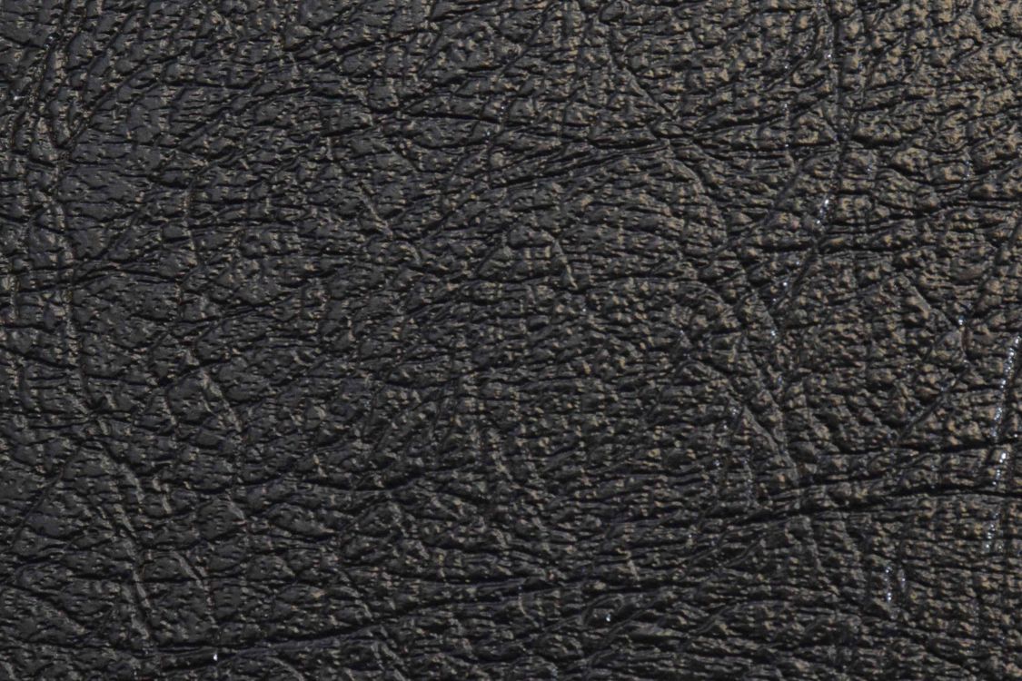 black leather textile in close up photography