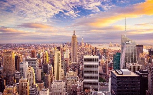 Image city skyline under blue and white cloudy sky during daytime