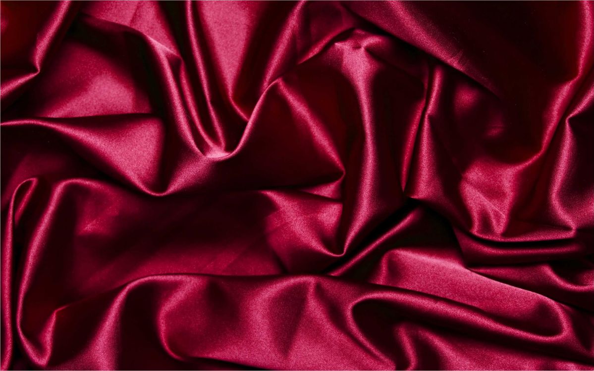 red textile on white textile