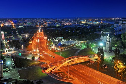 Image city with lights turned on during night time