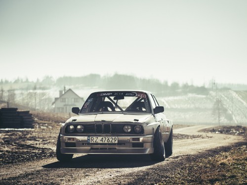 Image white audi r 8 on dirt road during daytime