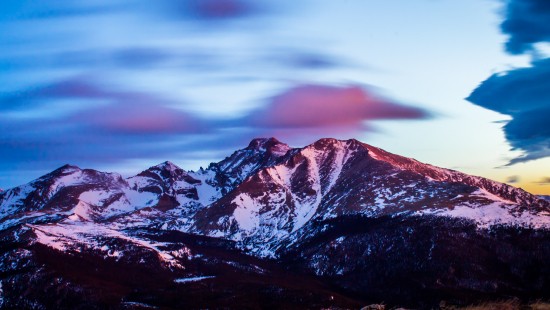 Image brown and white mountains under cloudy sky during daytime