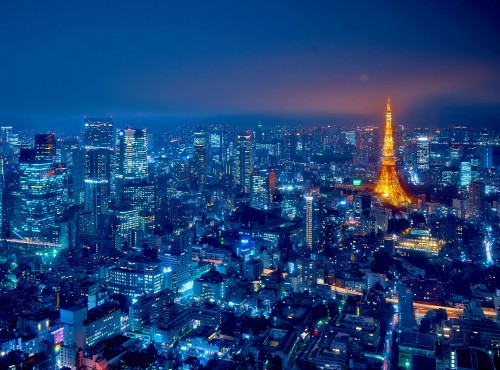 Image city with high rise buildings during night time