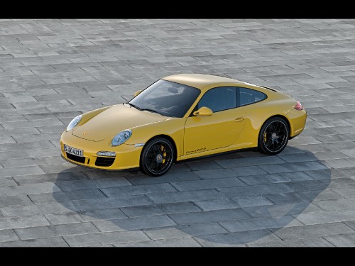 Image yellow porsche 911 parked on grey pavement