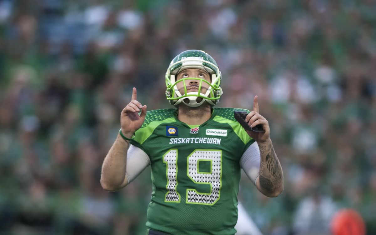 man in green and white football jersey