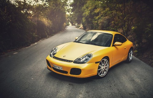 Image yellow porsche 911 on road during daytime