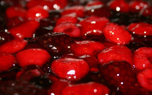 Image red round fruits in close up photography