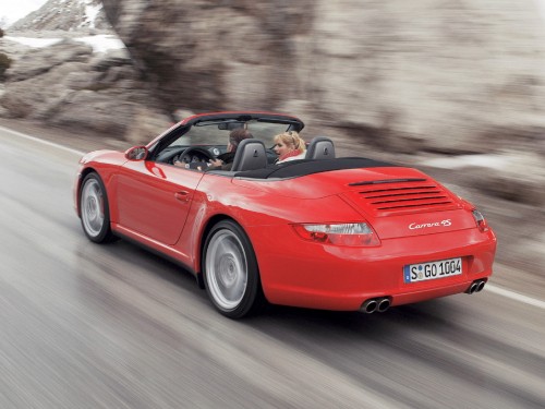 Image red ferrari convertible on road during daytime