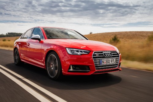 Image red audi coupe on road during daytime