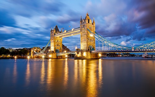 Image bridge over water during night time