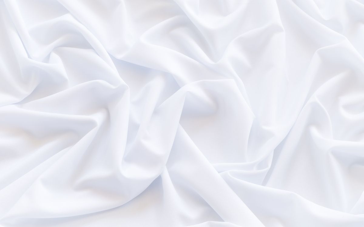 white textile in close up photography