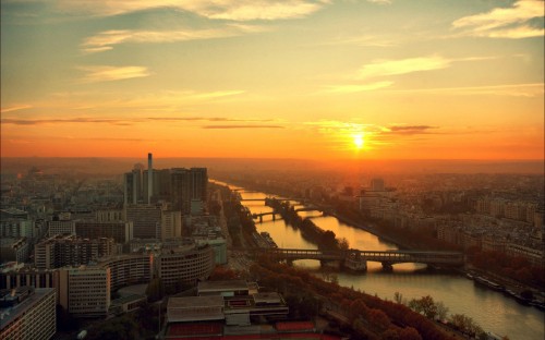 Image aerial view of city buildings during sunset