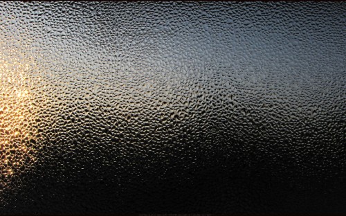 Image water droplets on black leather