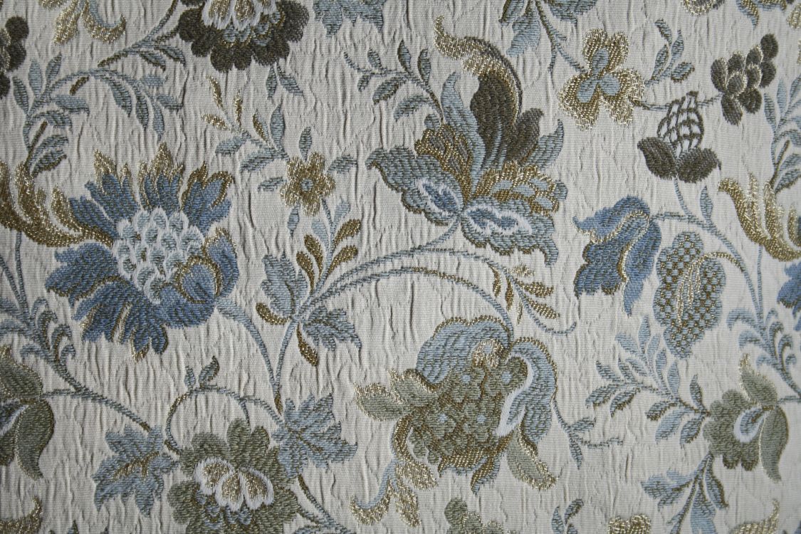 white and blue floral textile