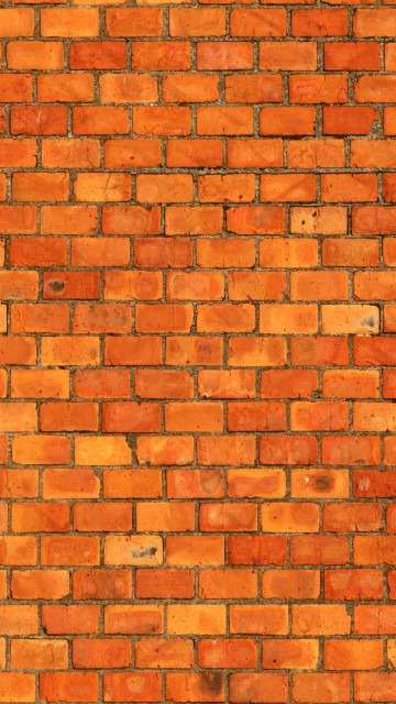 Image brown brick wall during daytime