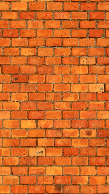 Image brown brick wall during daytime