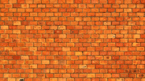 Image brown brick wall during daytime
