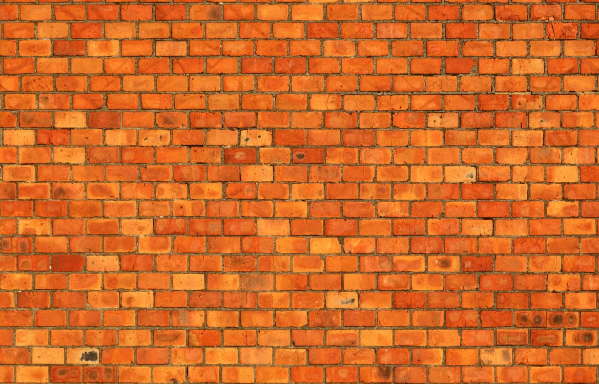 brown brick wall during daytime