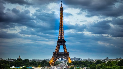 Image eiffel tower under cloudy sky during daytime