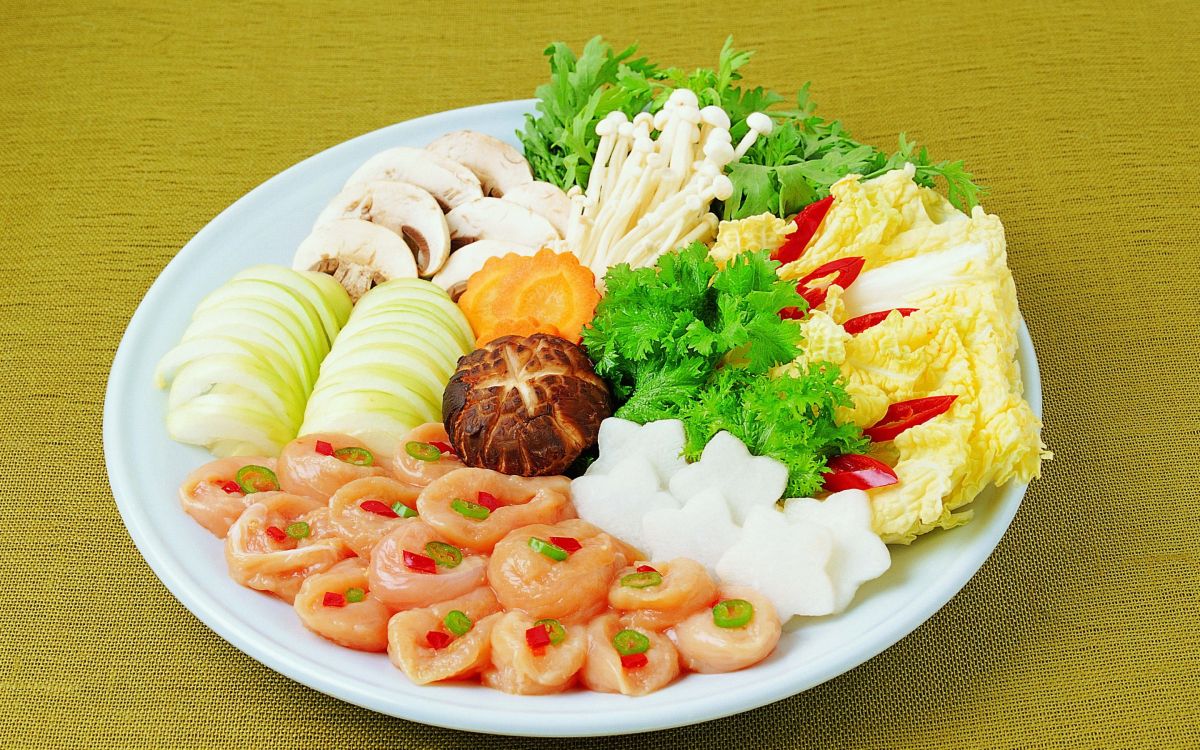 sliced meat with vegetable on white ceramic plate