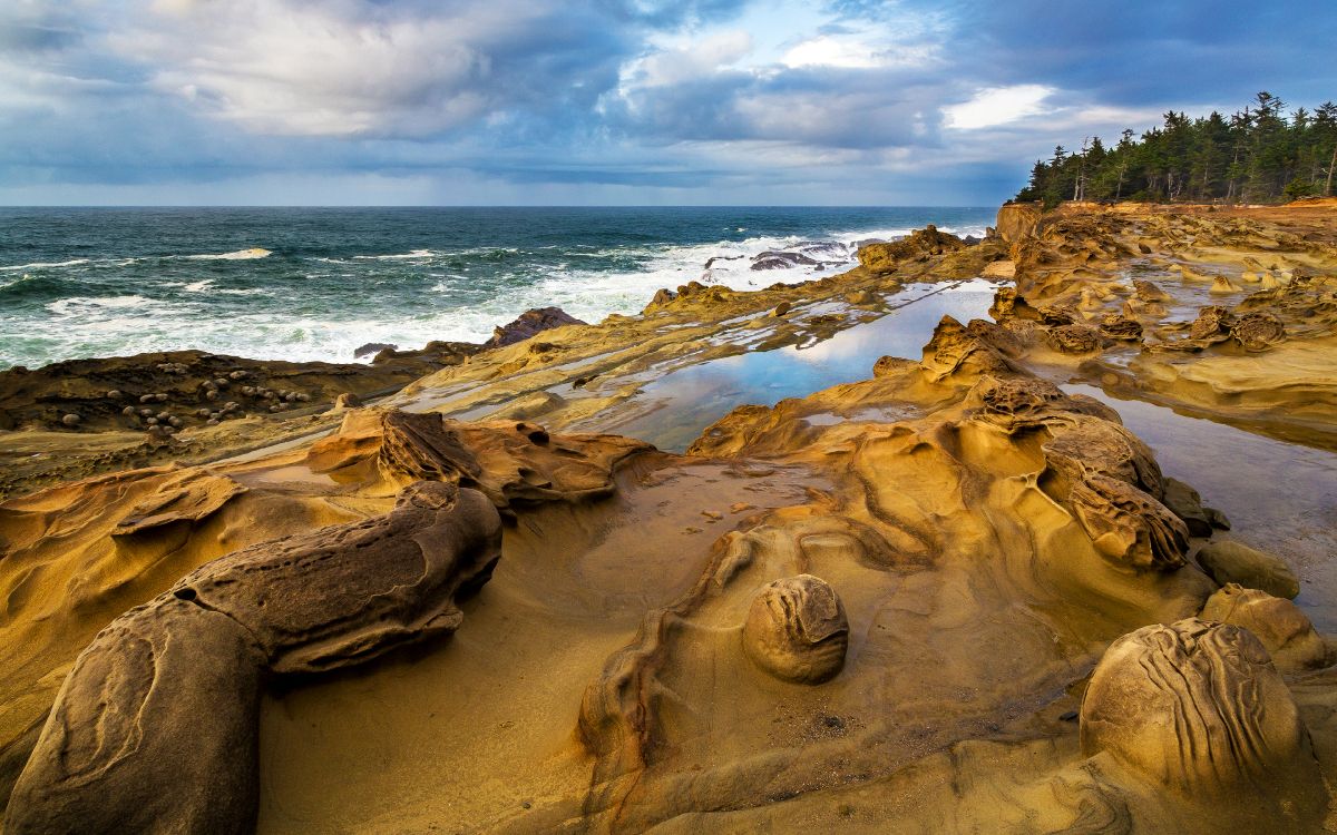 brown rock formation on seashore during daytime