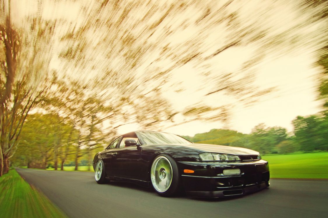 black bmw coupe on road during daytime