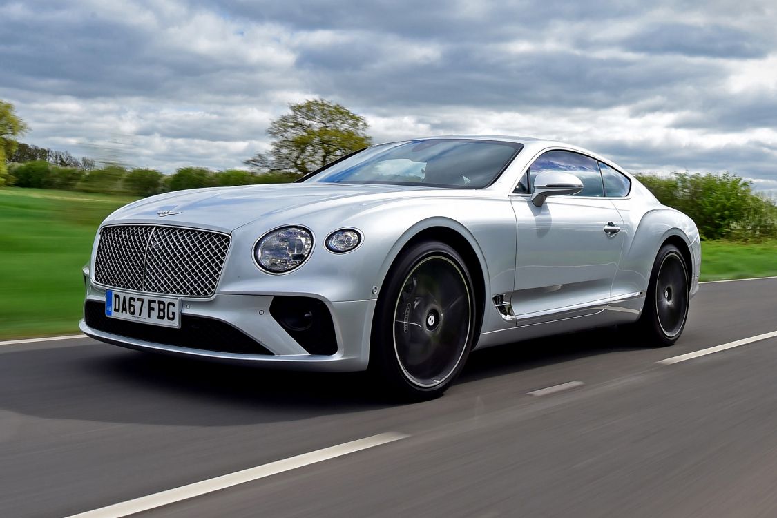 silver mercedes benz coupe on road during daytime