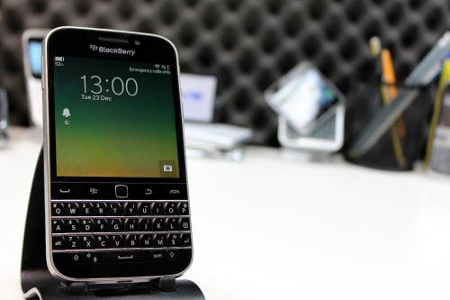 Image black blackberry qwerty phone on white table