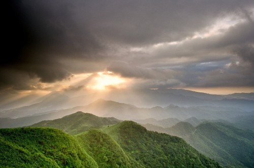 Image green mountains under white clouds during daytime