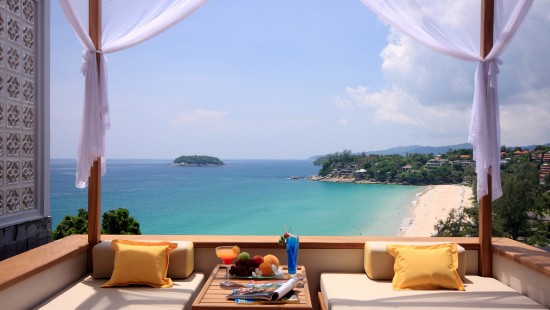 Image brown and white sofa chairs near body of water during daytime
