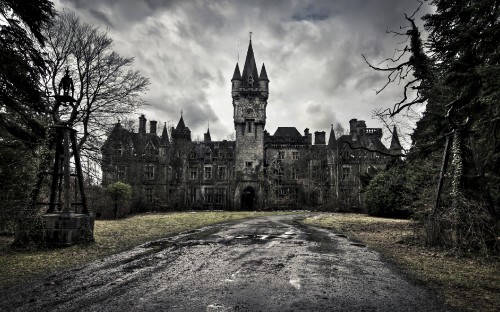 Image gray concrete castle under cloudy sky during daytime