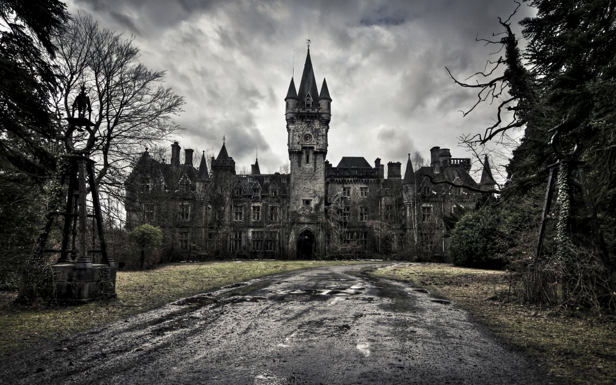 gray concrete castle under cloudy sky during daytime