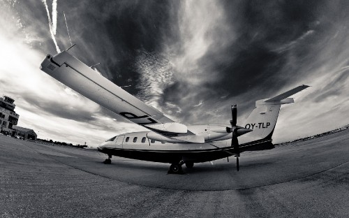 Image white airplane under white clouds during daytime