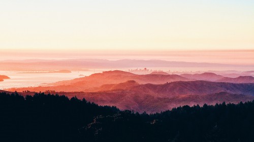 Image brown mountains under white sky during daytime