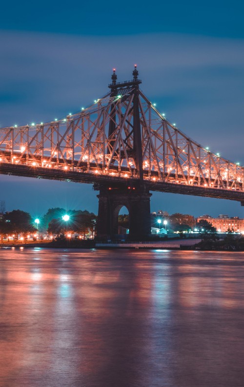 Image bridge over water during night time