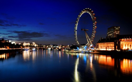 Image ferris wheel near body of water during night time