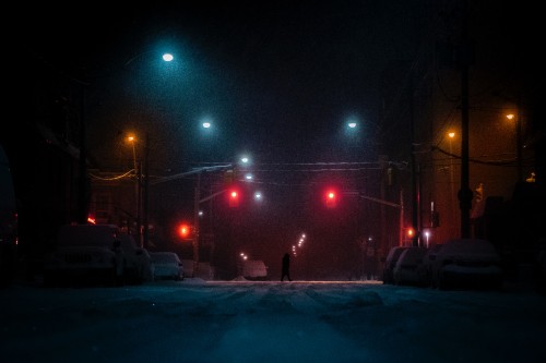 Image person walking on road during night time