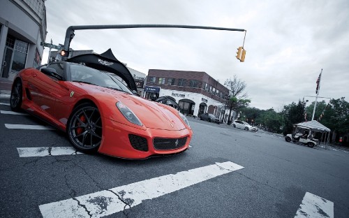 Image red ferrari sports car on road during daytime