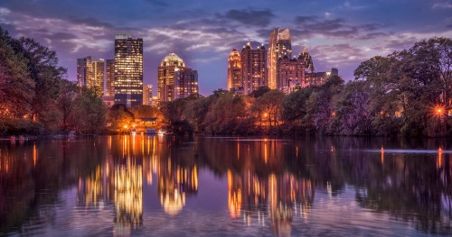 Image body of water near city buildings during night time