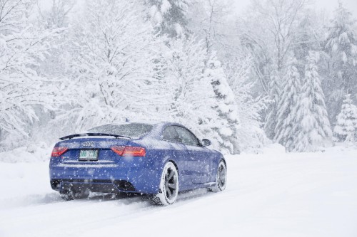 Image black porsche 911 on snow covered ground