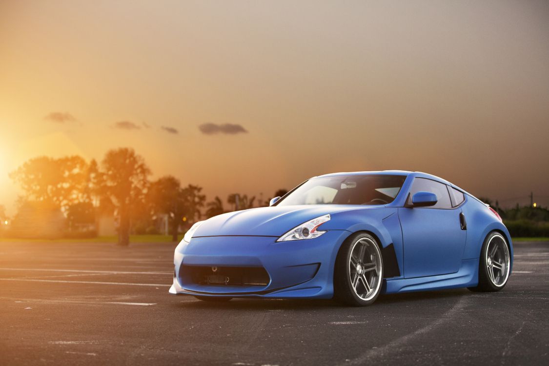 blue porsche 911 on road during daytime